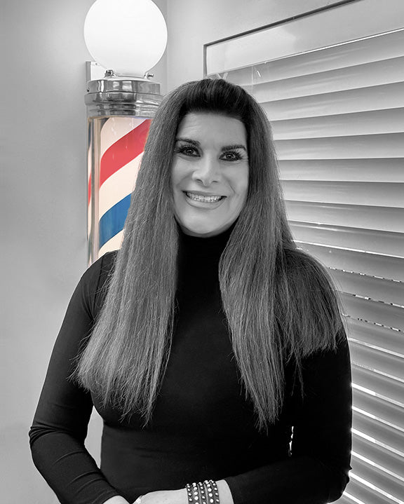 Gina, skilled barber offering traditional mens haircuts at Bullseye Barbershop of Draper.