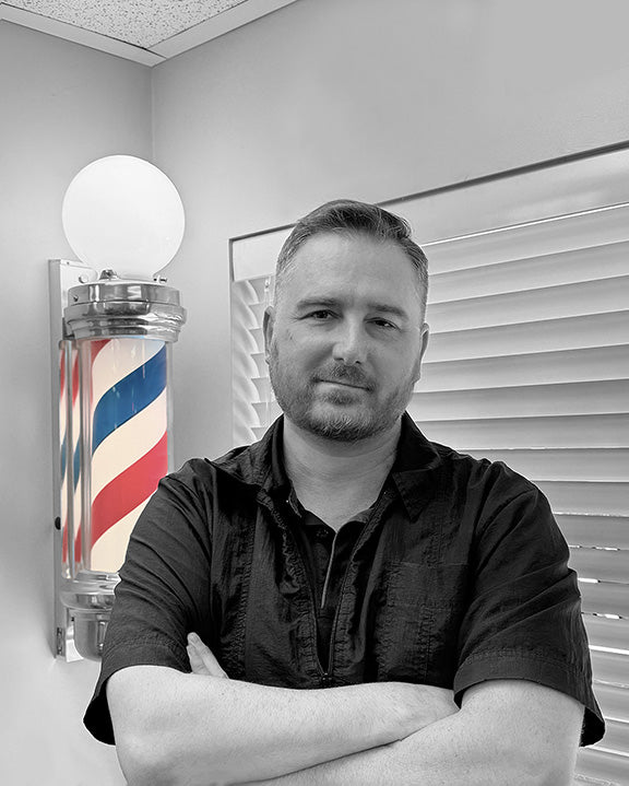 Joel, expert barber with fades, modern mullets and classic mens haircuts. working in Draper at Bullseye Barbershop.