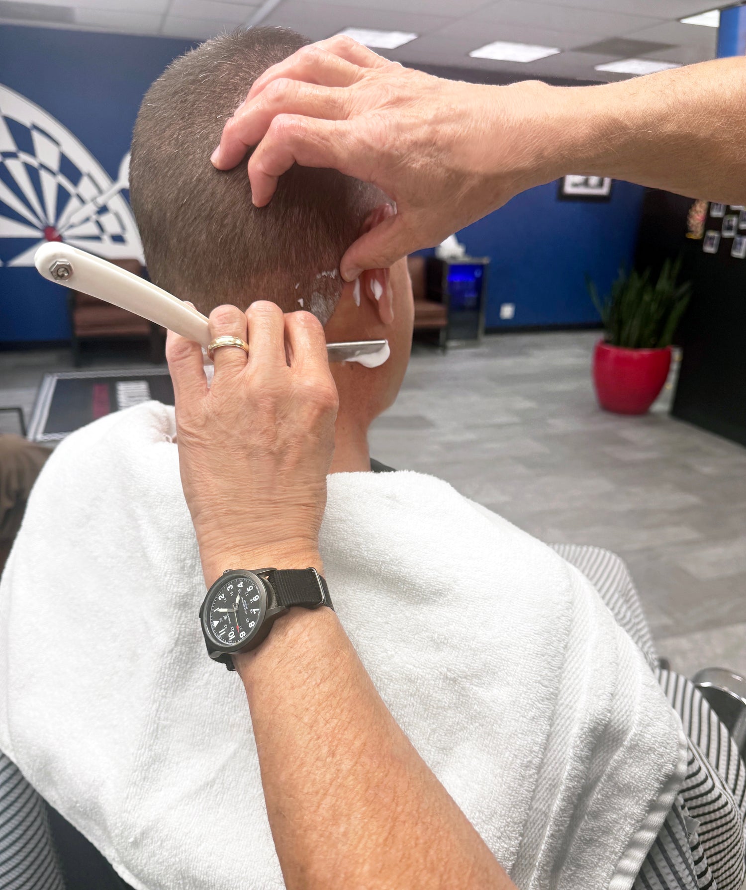 Warm lather straight razor neck shave is included with every haircut in Draper.